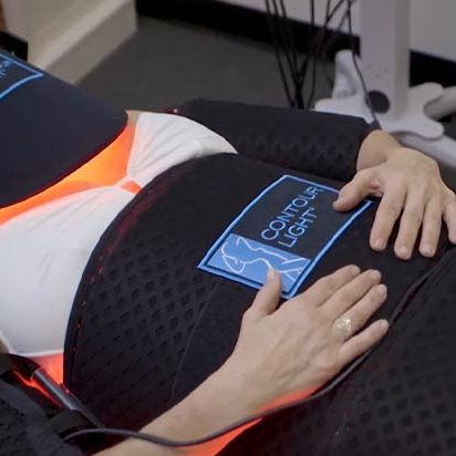 Chiropractic Arcadia CA Red Light Therapy Equipment On Cart Vertical Light Panels Woman Chiropractic Arcadia CA Red Light Therapy Equipment On Cart Vertical Light Panels Woman